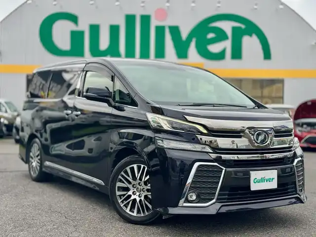 トヨタ ヴェルファイア Z Gエディション 滋賀県 2015(平27)年 5.9万km スパークリングブラックパールクリスタルシャイン ワンオーナー/T-Connect SDナビゲーションシステム/　＋JBLプレミアムサウンドシステム/　Blu-ray DVD CD SD AM/FM サウンドライブラリー/プリクラッシュセーフティシステム（ミリ波レーダー方式）パノラミックビューモニター/レーダークルーズコントロール/インテリジェンスクリアランスソナー /12.1型リヤシートエンターテインメントシステム/パワーバックドア/両側パワースライドドア/ナノイー/ビルトインETC/ドライブレコーダー/ヘッドランプ（LED［ハイ・ロービーム］//　オートレベリング機能付＋LEDクリアランスランプ）/ステアリングヒーター/スペアタイヤ/純正18インチアルミ/