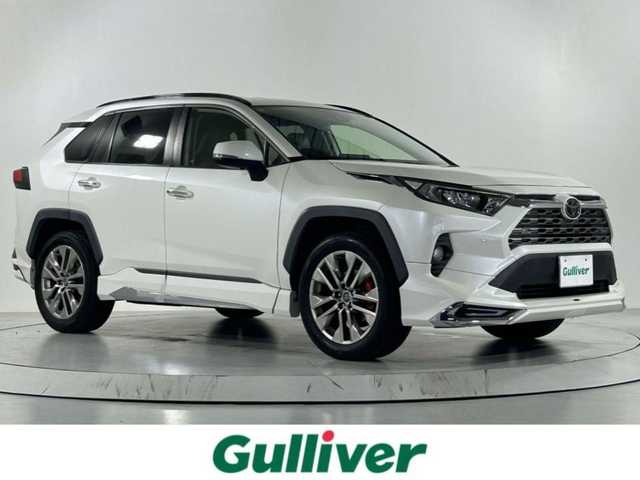 トヨタ ＲＡＶ４ G Zパッケージ 佐賀県 2019(令1)年 6.9万km ホワイトパールクリスタルシャイン モデリスタエアロ（フロント・サイド・リア）/社外9インチナビ/フルセグTV/Bluetooth/トヨタセーフティセンス/プリクラッシュセーフティ/レーントレーシングアシスト/ブラインドスポットモニター/クリアランスソナー/リアクロストラフィックアラート/ロードサインアシスト/追従付きクルーズコントロール/パワーバックドア/ステアリングヒーター/アダプティブヘッドライト/マルチテレイン/電子パーキング/前席シートヒーター/前後ドライブレコーダー/ETC2.0/デジタルインナーミラー/パワーシート/メモリーシート/レザーシート/純正19インチアルミホイール/フロアマット/スマートキー