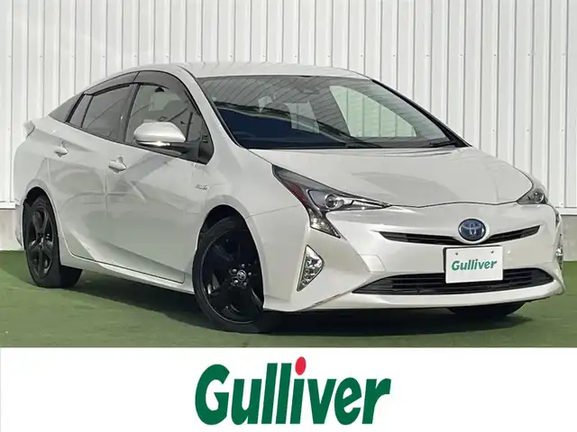 トヨタ プリウス S ツーリングセレクション 香川県 2016(平28)年 6.6万km ホワイトパールクリスタルシャイン 登録時走行距離：65500km/純正7インチナビ/→フルセグTV/→ＣＤ／ＤＶＤ/→Bluetooth/バックカメラ/レザーシート/シートヒーター/革巻きステアリング/ステアリングリモコン/レーダークルーズコントロール/レーンキープアシスト/LEDヘッドライト/オートハイビーム/オートライト/前方ドライブレコーダー/ETC/純正17インチアルミホイール/電動格納ウィンカーミラー/PWオールオート/スマートキー/プッシュスタート