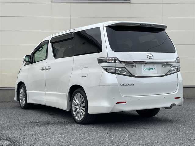 トヨタ ヴェルファイア 2．4Z Gエディション 道央・札幌 2012(平24)年 11.2万km ホワイトパールクリスタルシャイン 純正8インチナビ/フリップダウンモニター/革巻きステアリング/ステアリングスイッチ/クルーズコントロール/パワーシート/オットマン/両側パワースライドドア/パワーバックドア/バックカメラ/フォグランプ/スマートキー