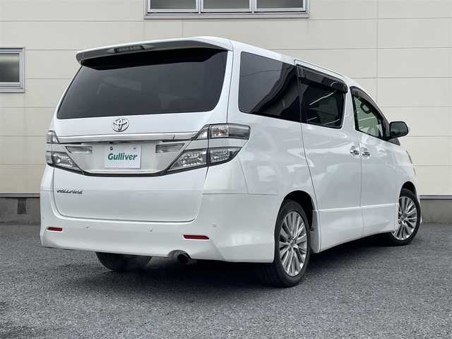 トヨタ ヴェルファイア 2．4Z Gエディション 道央・札幌 2012(平24)年 11.2万km ホワイトパールクリスタルシャイン 純正8インチナビ/フリップダウンモニター/革巻きステアリング/ステアリングスイッチ/クルーズコントロール/パワーシート/オットマン/両側パワースライドドア/パワーバックドア/バックカメラ/フォグランプ/スマートキー