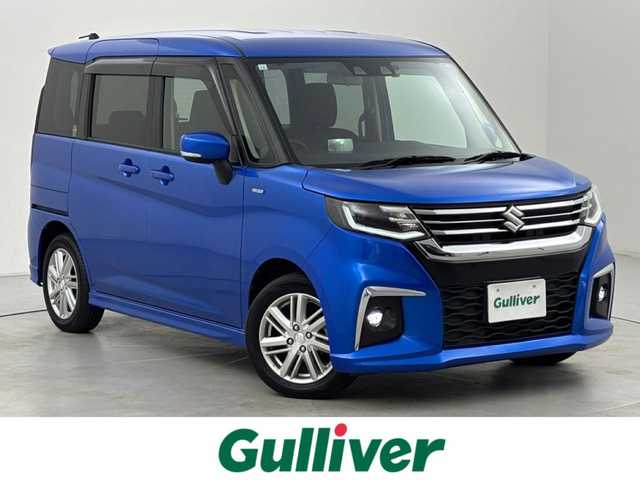 スズキ ソリオ HV MZ 福岡県 2023(令5)年 1.2万km スピーディーブルーM ワンオーナー　/後席モニター　/純正８型ナビ／フルセグＴＶ　/バックカメラ　/前後ドライブレコーダー　/レーダークルーズコントロール　/コーナーセンサー　/衝突被害軽減ブレーキ　/レーンキープ　/横滑り防止装置　/アイドリングストップ　/両側電動スライドドア　/シートヒーター　/ヘッドアップディスプレイ　/LEDヘッドライト　/純正１５インチアルミホイール