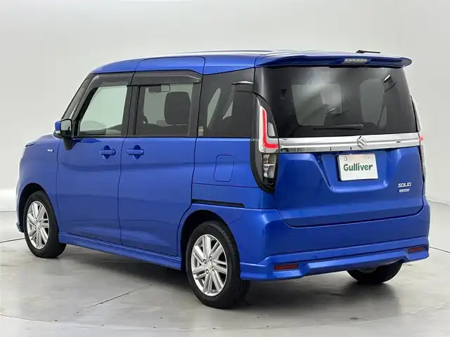 スズキ ソリオ HV MZ 福岡県 2023(令5)年 1.2万km スピーディーブルーM ワンオーナー　/後席モニター　/純正８型ナビ／フルセグＴＶ　/バックカメラ　/前後ドライブレコーダー　/レーダークルーズコントロール　/コーナーセンサー　/衝突被害軽減ブレーキ　/レーンキープ　/横滑り防止装置　/アイドリングストップ　/両側電動スライドドア　/シートヒーター　/ヘッドアップディスプレイ　/LEDヘッドライト　/純正１５インチアルミホイール