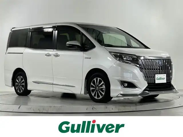 トヨタ エスクァイア ハイブリッド 佐賀県 2017(平29)年 7.8万km ホワイトパールクリスタルシャイン アルパイン製11インチナビ/フルセグテレビ/Bluetoothオーディオ接続/CD　DVD再生/アルパイン製後席モニター12，8インチ/モデリスタフルエアロ/ダブルゾーン/クルーズコントロール/トヨタセーフティーセンス/衝突軽減システム/両側パワースライドドア/ETC/前方ドライブレコーダー/レーンキープアシスト/横滑り防止装置/クリアランスソナー/ABS/オートライト/オートマチックハイビーム