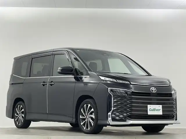 トヨタ ヴォクシー S－Z 埼玉県 2022(令4)年 1.8万km グリッターブラックガラスフレーク 純正ナビ　後席モニター　両側電動スライドドア　シートヒーター　バックカメラ　前後ドライブレコーダー　ETC2.0　追従走行　ＭＴモード付ＡＴ　Bluetooth　電動リアゲート　オートハイビーム　レーンアシスト　ウォークスルー　純正フロアマット