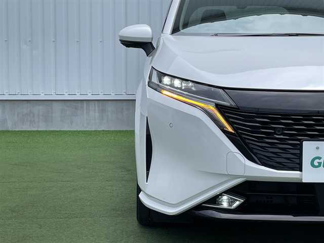 日産 オーラ G レザーエディション 香川県 2022(令4)年 2.6万km ピュアホワイトパール 登録時走行距離：26068km/純正9型ナビ/　CD DVD BT フルセグTV/全方位カメラ/エマージェンシーブレーキ/レーンキープアシスト/ブラインドスポットモニター/クリアランスソナー/ビルトインETC/前後ドライブレコーダー/デジタルインナーミラー/電子パーキングブレーキ/レザーシート/革巻きステアリング/ステアリングスイッチ/プッシュスタート/スマートキー/スペアキー