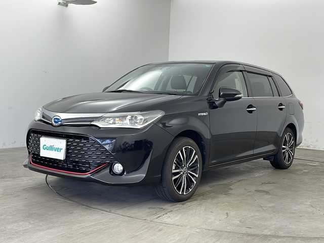 トヨタ カローラ フィールダー ハイブリッドG プラスレッド 兵庫県 2016(平28)年 5.8万km ブラックマイカ ・社外ナビ/・CD/DVD/BT/USB/iPod/ワンセグTV/・バックカメラ/・プリクラッシュセーフティ/・レーンディパーチャーアラート/・先行車発進告知/・オートマチックハイビーム/・横滑り防止装置/・LEDオートライト/・フォグランプ/・ステアリングリモコン/・シートヒーター（運転席＋助手席）/・ハーフレザーシート/・革巻きステアリング/・AAC/・nanoe/・ビルトインETC/・社外１６インチアルミホイール/・純正フロアマット/・オールオートパワーウィンドウ/・スマートキー/・スペアキー/・プッシュスタート/・W＋サイドエアバッグ/・カーテンエアバッグ