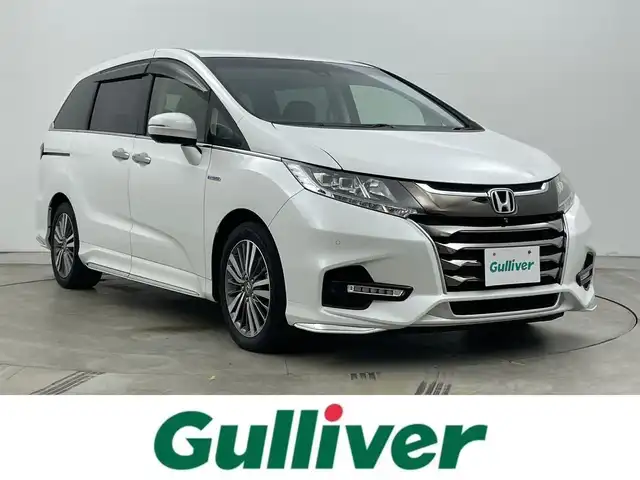 ホンダ オデッセイ ハイブリッド アブソルート・EXホンダセンジング 岡山県 2020(令2)年 8.1万km プラチナホワイトパール 純正９型ナビ(VXM-207VFNi)/【CD/DVD/BT/USB/Carplay/フルセグ/HDMI】/両側電動スライド　/全周囲カメラ　/レーダークルーズコントロール　/１００Ｖ電源　/ＥＴＣ2.0/シートヒーター　前席　/ＬＥＤヘッドライト　/ドライブレコーダー　前後　/ブラインドスポットモニター　/コーナーセンサー　前後/禁煙車/純正アルミ/アイドリングストップ/踏み間違い防止/ダブルエアコン