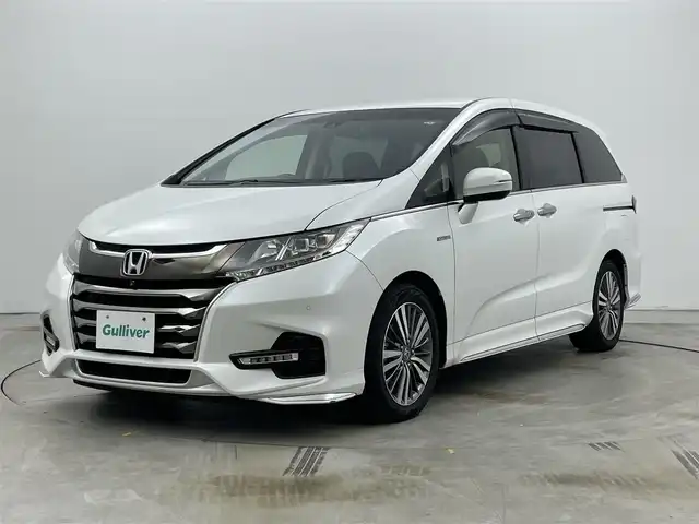 ホンダ オデッセイ ハイブリッド アブソルート・EXホンダセンジング 岡山県 2020(令2)年 8.1万km プラチナホワイトパール 純正９型ナビ(VXM-207VFNi)/【CD/DVD/BT/USB/Carplay/フルセグ/HDMI】/両側電動スライド　/全周囲カメラ　/レーダークルーズコントロール　/１００Ｖ電源　/ＥＴＣ2.0/シートヒーター　前席　/ＬＥＤヘッドライト　/ドライブレコーダー　前後　/ブラインドスポットモニター　/コーナーセンサー　前後/禁煙車/純正アルミ/アイドリングストップ/踏み間違い防止/ダブルエアコン