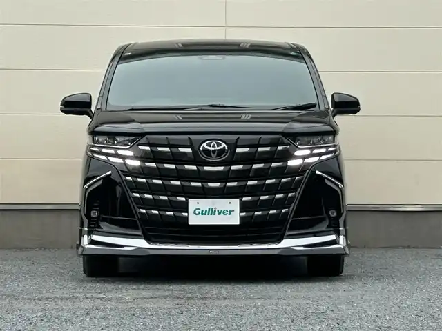 トヨタ アルファード Z 茨城県 2024(令6)年 1.1万km ブラック フルモデリスタエアロ/メーカーOPナビ/(AM/FM/BT/フルセグ)/全方位カメラ/サンルーフ/デジタルインナーミラー/ビルドインETC2.0/三眼ヘッドライト/両側パワースライドドア/レーダークルーズコントロール/クリアランスソナー/パワーシート/シートヒーター/エアシート/オットマン/3列シート/純正フロアマット/純正ドアバイザー/純正18インチアルミホイール