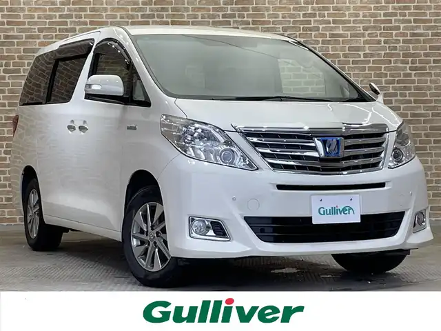 トヨタ アルファードハイブリット G 岩手県 2014(平26)年 5.9万km ゴールドパールクリスタルシャイン ワンオーナー/４WD/後席モニター/両側パワースライドドア/パワーバックドア/クルーズコントロール/クリアランスソナー/アダプティブフロントライティングシステム/ウォークスルー/オットマン/後席用オートエアコン/純正ナビ/フルセグTV/バックカメラ/ETC/ドライブレコーダー(本体未取り付け)/HIDヘッドランプ/フォグランプ/純正16インチアルミホイール