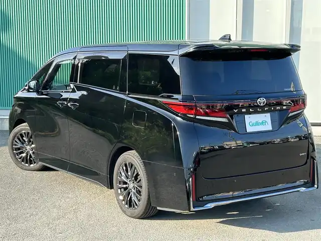 トヨタ ヴェルファイア ハイブリット Z プレミア 福岡県 2024(令6)年 1.9万km ブラック トヨタセーフティセンス/12.1型後席モニター/ガラスルーフ/純正ナビ（BT/フルセグ/AM/FM)/アラウンドビューモニター/バックカメラ/サイドカメラ/フロントカメラ/両側パワースライドドア/電動リアゲート/電動サイドバイザー/レーダークルーズコントロール/LEDヘッドライト/オートライト/オートマチックハイビーム/革シート/オットマン/DN席パワーシート/シートメモリー/全席エアシート/全席シートヒーター/ステアリングヒーター/チルトステアリング/純正19インチAW/パドルシフト/パーキングアシスト/横滑り防止装置/コーナーセンサー/レーンキープアシスト/盗難防止装置/衝突軽減システム/ワイヤレス充電/HDMI入力端子/スマートキー/ETC2.0/保証書/取扱説明書