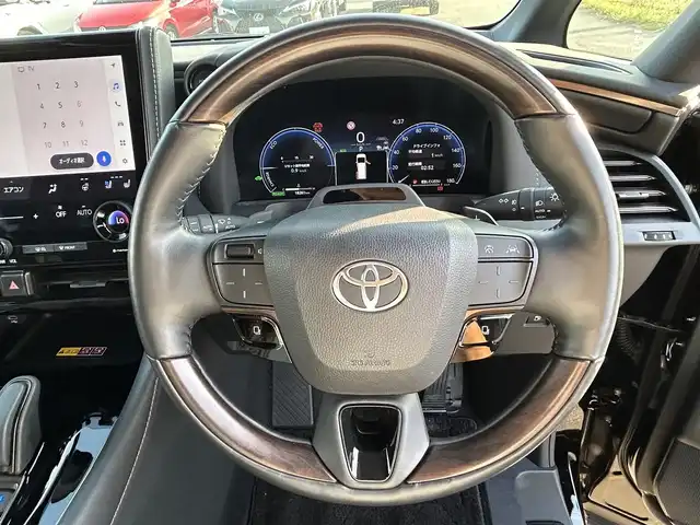 トヨタ ヴェルファイア ハイブリット Z プレミア 福岡県 2024(令6)年 1.9万km ブラック トヨタセーフティセンス/12.1型後席モニター/ガラスルーフ/純正ナビ（BT/フルセグ/AM/FM)/アラウンドビューモニター/バックカメラ/サイドカメラ/フロントカメラ/両側パワースライドドア/電動リアゲート/電動サイドバイザー/レーダークルーズコントロール/LEDヘッドライト/オートライト/オートマチックハイビーム/革シート/オットマン/DN席パワーシート/シートメモリー/全席エアシート/全席シートヒーター/ステアリングヒーター/チルトステアリング/純正19インチAW/パドルシフト/パーキングアシスト/横滑り防止装置/コーナーセンサー/レーンキープアシスト/盗難防止装置/衝突軽減システム/ワイヤレス充電/HDMI入力端子/スマートキー/ETC2.0/保証書/取扱説明書