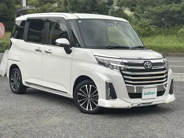 トヨタ ルーミー カスタムG－T 神奈川県 2022(令4)年 2.5万km パールホワイトⅢ ワンオーナー/社外９インチSDナビ・フルセグ・DVD・CD・SD・MSV・USB・Bluetoorh/アラウンドビューカメラ/ビルトインETC/革巻きステアリング/ステアリングリモコン/クルーズコントロール/社外ミラー型ドライブレコーダー/オートホールドメモリー機能/スマートアシスト/前席シートヒーター/シートバックテーブル（運転席・助手席背面）/純正１５インチアルミ/フロアマット/ドアバイザー/新車時保証書/取扱説明書/スマートキー×2