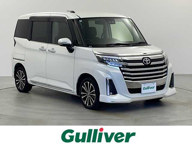 トヨタ ルーミー カスタムG－T 栃木県 2022(令4)年 2.5万km パールホワイトⅢ ワンオーナー/社外９インチSDナビ・フルセグ・DVD・CD・SD・MSV・USB・Bluetoorh/アラウンドビューカメラ/ビルトインETC/革巻きステアリング/ステアリングリモコン/クルーズコントロール/社外ミラー型ドライブレコーダー/オートホールドメモリー機能/スマートアシスト/前席シートヒーター/シートバックテーブル（運転席・助手席背面）/純正１５インチアルミ/フロアマット/ドアバイザー/新車時保証書/取扱説明書/スマートキー×2