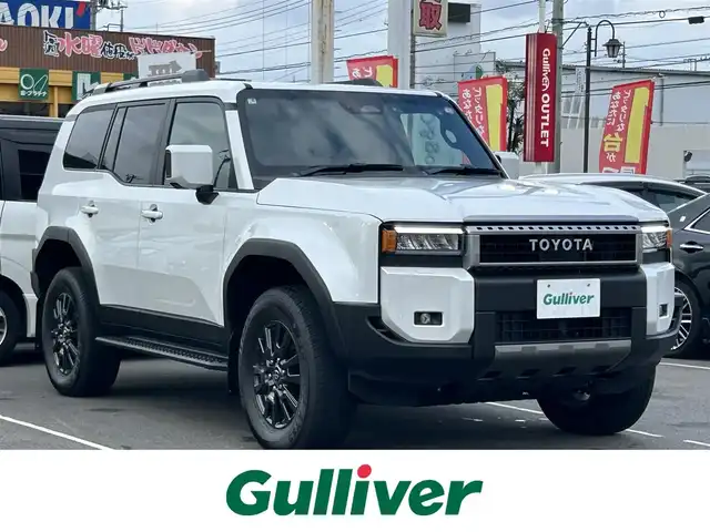 トヨタ ランドクルーザー ２５０ VX 群馬県 2025(令7)年 0.1万km プラチナホワイトパールマイカ 4WD/ワンオーナー/純正12.3型DAナビ・フルセグTV/パイオニアプレミアムサウンド/Bluetooth・USB・HDMI・ミラキャスト/パノラミックビューモニター/ムーンルーフ/前席ベンチレーション・ヒーター/運転席パワーシート/ステアリングヒーター/デジタルインナーミラー/パワーバックドア/セーフティセンス/トヨタチームメイト/プリクラッシュセーフティ/レーダークルーズコントロール/レーントレーシングアシスト/レーンディパーチャーアラート/オートマチックハイビーム/ブラインドスポットモニター/純正フロアマット/3眼LEDヘッドランプ/LEDフォグランプ/LEDリアフォグランプ/ブラックルーフレール/純正18インチアルミ