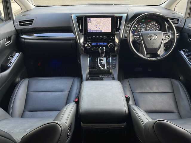 トヨタ アルファードハイブリット SR Cパッケージ 青森県 2021(令3)年 6.9万km ホワイトパールクリスタルシャイン 4WD/純正9インチDAナビ・フルセグTV/純正12.1インチフリップダウンモニター/CD・DVD・Bluetooth・ミラキャスト/黒革シート/前席エアシート・ヒーター/ステアリングヒーター/両側パワースライドドア/パワーバックドア/セーフティセンス/プリクラッシュセーフティ/レーダークルーズコントロール/レーントレーシングアシスト/アダプティブハイビームシステム/パーキングサポートブレーキ/AC100V1500W/ビルトインETC/3眼LEDヘッドランプ/LEDフォグランプ/社外車高調（純正有）/社外20インチアルミ/モデリスタエアロ/スペアキー/保証書・取説書