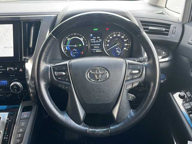 トヨタ アルファードハイブリット SR Cパッケージ 青森県 2021(令3)年 6.9万km ホワイトパールクリスタルシャイン 4WD/純正9インチDAナビ・フルセグTV/純正12.1インチフリップダウンモニター/CD・DVD・Bluetooth・ミラキャスト/黒革シート/前席エアシート・ヒーター/ステアリングヒーター/両側パワースライドドア/パワーバックドア/セーフティセンス/プリクラッシュセーフティ/レーダークルーズコントロール/レーントレーシングアシスト/アダプティブハイビームシステム/パーキングサポートブレーキ/AC100V1500W/ビルトインETC/3眼LEDヘッドランプ/LEDフォグランプ/社外車高調（純正有）/社外20インチアルミ/モデリスタエアロ/スペアキー/保証書・取説書