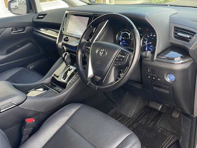 トヨタ アルファードハイブリット SR Cパッケージ 青森県 2021(令3)年 6.9万km ホワイトパールクリスタルシャイン 4WD/純正9インチDAナビ・フルセグTV/純正12.1インチフリップダウンモニター/CD・DVD・Bluetooth・ミラキャスト/黒革シート/前席エアシート・ヒーター/ステアリングヒーター/両側パワースライドドア/パワーバックドア/セーフティセンス/プリクラッシュセーフティ/レーダークルーズコントロール/レーントレーシングアシスト/アダプティブハイビームシステム/パーキングサポートブレーキ/AC100V1500W/ビルトインETC/3眼LEDヘッドランプ/LEDフォグランプ/社外車高調（純正有）/社外20インチアルミ/モデリスタエアロ/スペアキー/保証書・取説書