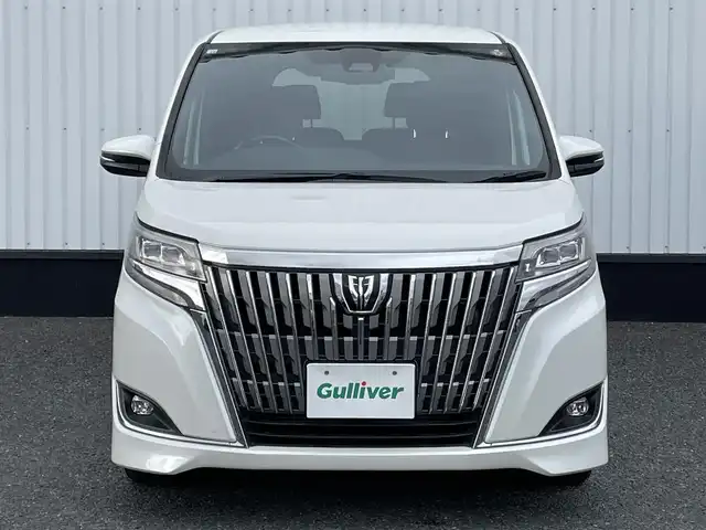 トヨタ エスクァイア Gi プレミアムパッケージ 千葉県 2018(平30)年 7万km ホワイトパールクリスタルシャイン 純正9インチSDナビ/(フルセグＴＶ/Bluetooth/CD/DVD)/バックカメラ/衝突被害軽減システム/車線逸脱警報/クルーズコントロール/フリップダウンモニター/レザーシート/両側パワースライドドア/横滑り防止装置/ETC/ドライブレコーダー/アイドリングストップ/LEDヘッドライト/フォグランプ/オートライト/ウィンカーミラー/電動格納ミラー/純正15インチAW/シートヒーター/シートリフター/ステアリングヒーター/プッシュスタート/スマートキー/フロアマット/ドアバイザー/取扱説明書/保証書