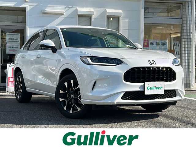 ホンダ ＺＲ－Ｖ ハイブリッド e:HEV Z 愛知県 2023(令5)年 3.6万km プラチナホワイトパール ・禁煙車/・純正９インチナビ/・フルセグTV/・BOSEプレミアムサウンド/・マルチヴューカメラ/・黒本革シート/・ホンダセンシング/・前席パワーシート/・前席シートヒーター/・前後ドライブレコーダー/・ビルトインETC2.0/・ワイヤレス充電/・アダプティブドライビングビーム/・ステアリングヒーター/・ハンズフリーパワーテールゲート/・パドルシフト/・ドライブモードスイッチ/・純正１８インチアルミ/・パーキングセンサー/・電子パーキング/・電動格納ミラーウインカー/・純正フロアマット/・取扱説明書