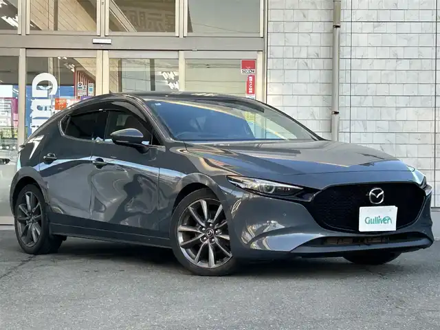 マツダ マツダ３ファストバック 20S バーガンディセレクション 岩手県 2020(令2)年 5.6万km セラミックM 4WD/ワンオーナー /純正ナビ /DVD再生/フルセグTV/赤革シート /ETC /バックカメラ /運転席パワーシート /前席シートヒーター /ステアリングヒーター /ステアリングスイッチ/社外前後ドラレコ /革巻きステアリング/レーダークルコン/オートライト/オートハイビーム/パドルシフト/ドアバイザー/フロアマット/リアワイパー/衝突軽減装置/保証書
