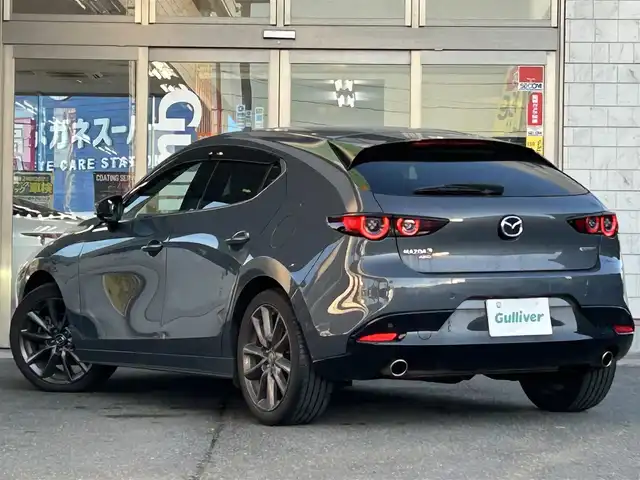 マツダ マツダ３ファストバック 20S バーガンディセレクション 岩手県 2020(令2)年 5.6万km セラミックM 4WD/ワンオーナー /純正ナビ /DVD再生/フルセグTV/赤革シート /ETC /バックカメラ /運転席パワーシート /前席シートヒーター /ステアリングヒーター /ステアリングスイッチ/社外前後ドラレコ /革巻きステアリング/レーダークルコン/オートライト/オートハイビーム/パドルシフト/ドアバイザー/フロアマット/リアワイパー/衝突軽減装置/保証書