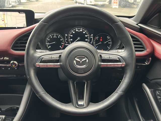 マツダ マツダ３ファストバック 20S バーガンディセレクション 岩手県 2020(令2)年 5.6万km セラミックM 4WD/ワンオーナー /純正ナビ /DVD再生/フルセグTV/赤革シート /ETC /バックカメラ /運転席パワーシート /前席シートヒーター /ステアリングヒーター /ステアリングスイッチ/社外前後ドラレコ /革巻きステアリング/レーダークルコン/オートライト/オートハイビーム/パドルシフト/ドアバイザー/フロアマット/リアワイパー/衝突軽減装置/保証書