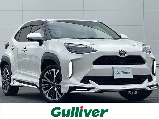 トヨタ ヤリスクロス Z 佐賀県 2021(令3)年 5.9万km ホワイトパールクリスタルシャイン モデリスタエアロ(F/S/R)/トヨタセーフティセンス/・プリクラッシュセーフティ/・レーダークルーズコントロール（全車速追従機能付）/・レーンディパーチャーアラート/・オートマチックハイビーム/ブラインドスポットモニター（BSM）/クリアランスソナー/純正ディスプレイオーディオ/・フルセグTV/Bluetooth/パノラミックビューモニター/ETC/純正18インチAW/革巻ステアリング/ステアリングスイッチ/電動パーキングスイッチ/黒革調シートカバー/パワーシート/前席シートヒーター/LEDヘッドランプ/前後ドラレコ(DC-DR652)/プッシュスタート/スペアキー×1/取扱説明書/保証書