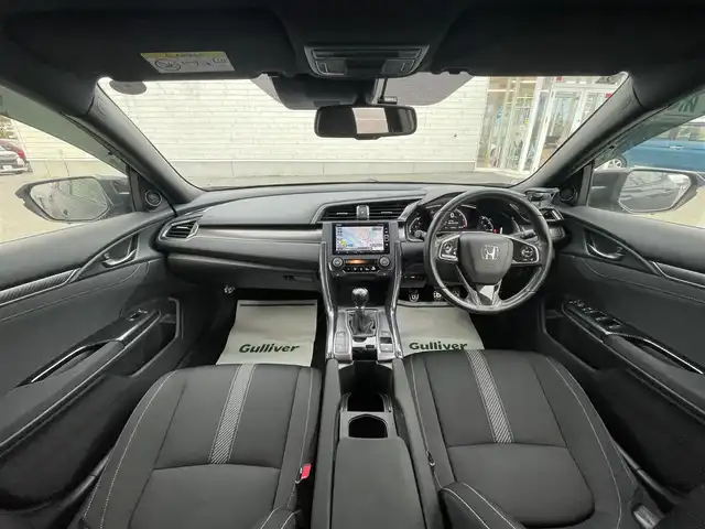 ホンダ シビック ハッチバック ホンダセンシング 山形県 2019(平31)年 9.5万km クリスタルブラックパール 禁煙車/ターボ/純正SDナビ/・TV/AM/FM/CD/DVD/Bluetooth/アペックスマフラー/アダプティブクルーズコントロール/アイドリングストップ/レーンキープアシスト/標識認識機能/衝突被害軽減ブレーキ/横滑り防止装置/盗難防止装置/LEDヘッドライト/オートライト/フロントフォグランプ/電動パーキングブレーキ/バックカメラ/前後ドライブレコーダー/シートヒーター（D/N席）/純正フロアマット/純正ドアバイザー/ETC