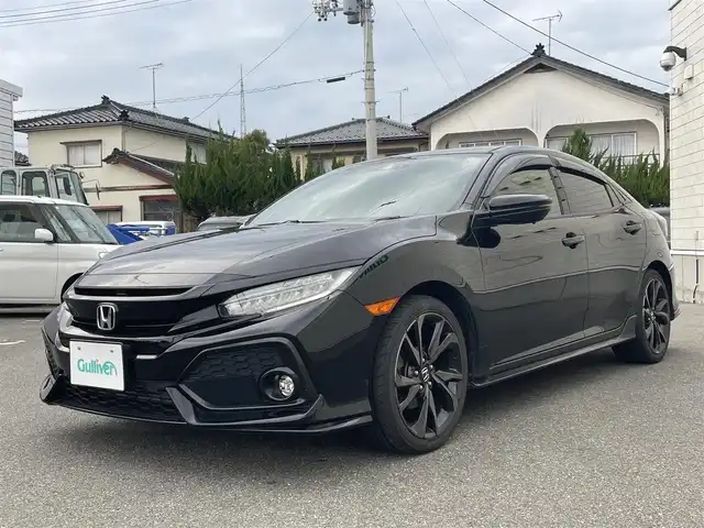 ホンダ シビック ハッチバック ホンダセンシング 山形県 2019(平31)年 9.5万km クリスタルブラックパール 禁煙車/ターボ/純正SDナビ/・TV/AM/FM/CD/DVD/Bluetooth/アペックスマフラー/アダプティブクルーズコントロール/アイドリングストップ/レーンキープアシスト/標識認識機能/衝突被害軽減ブレーキ/横滑り防止装置/盗難防止装置/LEDヘッドライト/オートライト/フロントフォグランプ/電動パーキングブレーキ/バックカメラ/前後ドライブレコーダー/シートヒーター（D/N席）/純正フロアマット/純正ドアバイザー/ETC