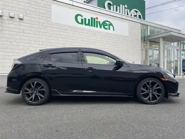 ホンダ シビック ハッチバック ホンダセンシング 山形県 2019(平31)年 9.5万km クリスタルブラックパール 禁煙車/ターボ/純正SDナビ/・TV/AM/FM/CD/DVD/Bluetooth/アペックスマフラー/アダプティブクルーズコントロール/アイドリングストップ/レーンキープアシスト/標識認識機能/衝突被害軽減ブレーキ/横滑り防止装置/盗難防止装置/LEDヘッドライト/オートライト/フロントフォグランプ/電動パーキングブレーキ/バックカメラ/前後ドライブレコーダー/シートヒーター（D/N席）/純正フロアマット/純正ドアバイザー/ETC