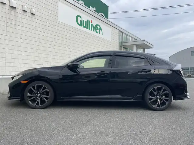 ホンダ シビック ハッチバック ホンダセンシング 山形県 2019(平31)年 9.5万km クリスタルブラックパール 禁煙車/ターボ/純正SDナビ/・TV/AM/FM/CD/DVD/Bluetooth/アペックスマフラー/アダプティブクルーズコントロール/アイドリングストップ/レーンキープアシスト/標識認識機能/衝突被害軽減ブレーキ/横滑り防止装置/盗難防止装置/LEDヘッドライト/オートライト/フロントフォグランプ/電動パーキングブレーキ/バックカメラ/前後ドライブレコーダー/シートヒーター（D/N席）/純正フロアマット/純正ドアバイザー/ETC