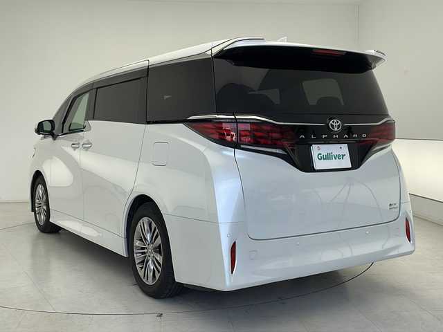 トヨタ アルファードハイブリット Z 千葉県 2024(令6)年 1.3万km プラチナホワイトパールマイカ ワンオーナー/４WD/純正メーカーOPメモリナビ、Bluetooth、/フルセグTV、ミラーキャスト/純正フリップダウンモニター/アラウンドビューモニター/プリクラッシュ/ロードサインアシスト/レーンキープアシスト/クリアランスソナー（前後）/ブラインドスポットモニター/フリップダウンモニター/レーダークルーズコントロール/横滑り防止装置/盗難防止装置/W、サイド、カーテンエアバッグ/オートマチックハイビーム/社外ドライブレコダー（前後録画）/黒レザーシート/２列目オットマン/前席、2列目パワーシート/前席、2列目シートヒーター/前席、2列目エアシート/両側パワースライドドア/パワーバックドア/ウインカーミラー/LEDヘッドライト/ビルトインETC2.0/スマートキー×１/純正フロアマット/純正18インチアルミホイール/スマートキー/皮巻きステアリング/フォグライト/ドアバイザー/TVキャンセラー/整備手帳