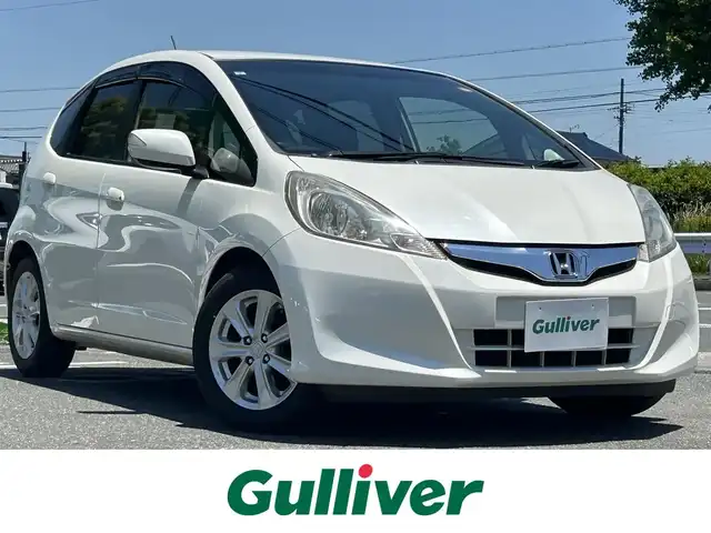 ホンダ フィット XH ファインスタイル 愛知県 2013(平25)年 6.9万km プレミアムホワイトパール 純正ナビ/(CD/DVD/ワンセグ)/シートヒーター/ハーフレザー/ビルトインETC/ドライブレコーダー/オートライト/レザーステアリング/スペアキー/保証書/取扱説明書