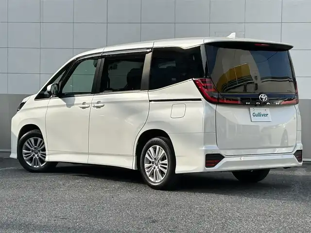 トヨタ ノア S－G 東京都 2023(令5)年 2.1万km ホワイトパールクリスタルシャイン 純正ナビ/バックカメラ/プリクラッシュセーフティ/レーンディパーチャーアラート/レーダークルーズコントロール/レーントレーシングアシスト/ロードサインアシスト/オートマチックハイビーム/プロアクティブドライビングアシスト/両側パワースライドドア/コーナーセンサー/ステアリングスイッチ/純正16インチアルミホイール/LEDヘッドライト/フォグランプ/オートライト/プッシュスタート/スマートキー/純正ドアバイザー/純正フロアマット/ウィンカーミラー/ドアバイザー