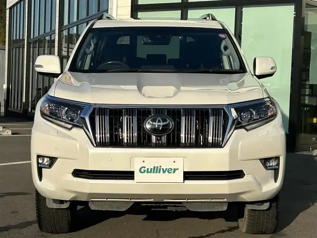 トヨタ ランドクルーザー プラド TX Lパッケージ 愛媛県 2023(令5)年 3.9万km ホワイトパールクリスタルシャイン ワンオーナー/純正ナビ（Bluetooth/フルセグTV）/アラウンドビューモニター/デジタルインナーミラー/TRDプッシュスタートボタン/電動格納サードシート/ETC2.0/電子インナーミラー型ドライブレコーダー/パワーシート/シートヒーター/シートベンチレーション/サンルーフ/アダプティブクルーズコントロール/スペアキー（スマートキー）/純正フロアマット/純正19インチアルミホイール/ルーフレール/センターデフロック/ダウンヒルアシストコントロール/LEDヘッドライト/フォグランプ/スペアタイヤ/保証書/取扱説明書/ナビ取説