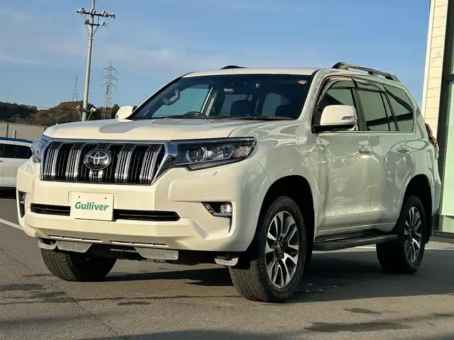 トヨタ ランドクルーザー プラド TX Lパッケージ 愛媛県 2023(令5)年 3.9万km ホワイトパールクリスタルシャイン ワンオーナー/純正ナビ（Bluetooth/フルセグTV）/アラウンドビューモニター/デジタルインナーミラー/TRDプッシュスタートボタン/電動格納サードシート/ETC2.0/電子インナーミラー型ドライブレコーダー/パワーシート/シートヒーター/シートベンチレーション/サンルーフ/アダプティブクルーズコントロール/スペアキー（スマートキー）/純正フロアマット/純正19インチアルミホイール/ルーフレール/センターデフロック/ダウンヒルアシストコントロール/LEDヘッドライト/フォグランプ/スペアタイヤ/保証書/取扱説明書/ナビ取説