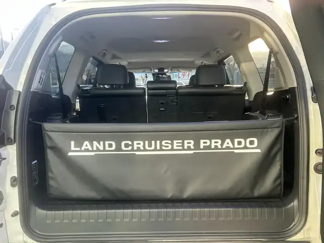 トヨタ ランドクルーザー プラド TX Lパッケージ 愛媛県 2023(令5)年 3.9万km ホワイトパールクリスタルシャイン ワンオーナー/純正ナビ（Bluetooth/フルセグTV）/アラウンドビューモニター/デジタルインナーミラー/TRDプッシュスタートボタン/電動格納サードシート/ETC2.0/電子インナーミラー型ドライブレコーダー/パワーシート/シートヒーター/シートベンチレーション/サンルーフ/アダプティブクルーズコントロール/スペアキー（スマートキー）/純正フロアマット/純正19インチアルミホイール/ルーフレール/センターデフロック/ダウンヒルアシストコントロール/LEDヘッドライト/フォグランプ/スペアタイヤ/保証書/取扱説明書/ナビ取説