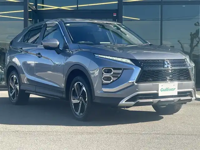 三菱 エクリプス クロス ＰＨＥＶ G 愛媛県 2020(令2)年 2万km チタニウムグレーメタリック 純正ナビ（Bluetooth/フルセグTV）/アラウンドビューモニター/AppleCarPlay/AndroidAuto/アダプティブクルーズコントロール/ETC2.0/パワーシート/ハーフレザーシート/シートヒーター/ブラインドスポットモニター/ステアリングヒーター/ドライブモード/純正18インチアルミホイール/前後ドライブレコーダー/前後コーナーセンサー/オートマチックハイビーム/LEDヘッドライト/スマートキー×２