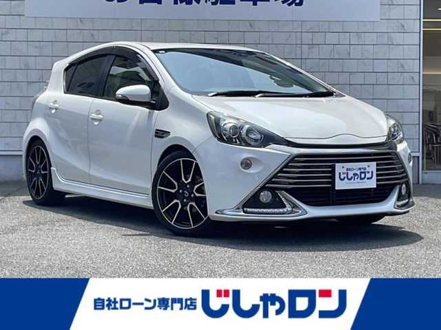 トヨタ アクア G G’s 山口県 2014(平26)年 9.8万km ライムホワイトパールクリスタルシャイン (株)IDOMが運営する【じしゃロン宇部店】の自社ローン専用車両になります。こちらは現金またはオートローンご利用時の価格です。自社ローンご希望の方は別途その旨お申付け下さい。/Ｂｌｕｅｔｏｏｔｈ接続/純正ナビ/バックカメラ/ＥＴＣ/前後ドライブレコーダー/ＬＥＤヘッドライト/純正１７インチアルミホイール/ハーフレザーシート/純正フロアマット/スマートキー/オートライト