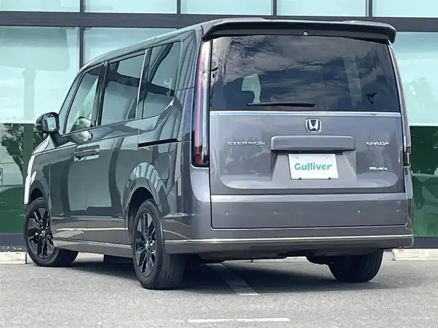 ホンダ ステップワゴン スパーダ eHEV 和歌山県 2022(令4)年 2.7万km スーパープラチナグレーメタリック 純正9インチナビ/バックカメラ/フルセグTV/BT/衝突軽減ブレーキ/前後コーナーセンサー/レーダークルコン/ブラインドスポットモニター/オートライト/レーンキープアシスト/ドラレコ/ビルトインETC/両側パワスラ/シートヒーター/電動リアゲート/オットマン/オートホールド/パドルシフト/LEＤヘッドライト/フォグランプ