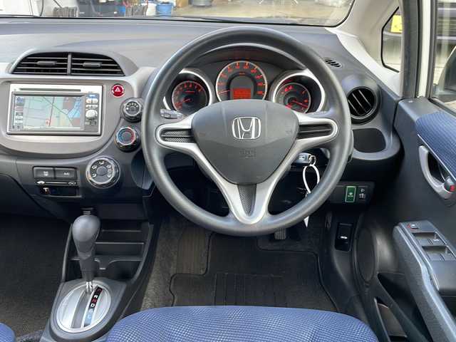 ホンダ フィット G 富山県 2012(平24)年 3.6万km プレミアムホワイトパール ワンオーナー/禁煙車/純正ＳＤナビ/バックカメラ/ＣＤ・ＤＶＤ/ワンセグＴＶ/純正フロアマット/リモコンキー/スペアキー/電動格納ミラー/ハロゲンヘッドライト/保証書