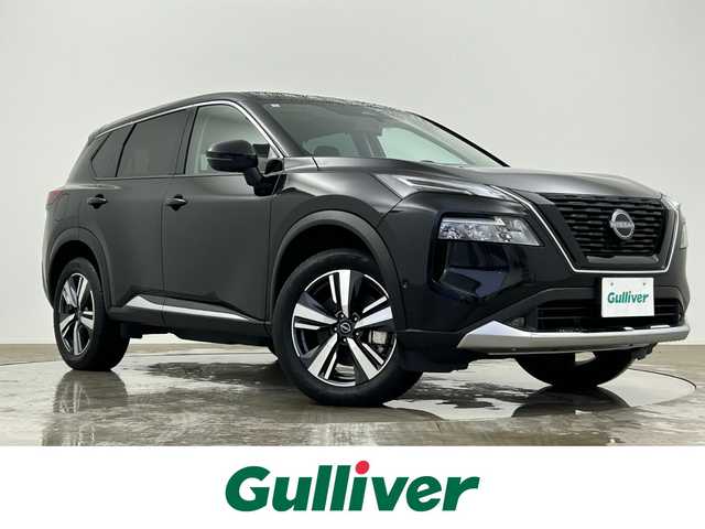 日産 エクストレイル G e－4ORCE 大分県 2024(令6)年 0.2万km ダイヤモンドブラック 純正１２．３インチナビ　/（Bluetooth/フルセグTV/USB端子/CarPlay）　/駐車支援（プロパイロットパーキング）/アラウンドビューモニター　/プロパイロット　/１００Ｖ電源　　/ビルトインETC2.0　/デジタルインナーミラー/LEDライト/電動リアゲード/前席パワーシート/運転席ポジションメモリー/各席シートヒーター/ステアリングヒーター/ステアリングスイッチ/オートブレーキホールド/保証書/スペアキー/純正アルミホイール