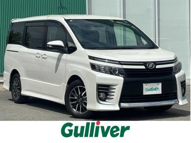 トヨタ ヴォクシー ZS 福岡県 2014(平26)年 8.9万km ホワイトパールクリスタルシャイン １６インチアルミホイール/両側パワースライドドア　/純正ＥＴＣ　/ＬＥＤヘッドライト　/アルパインビッグナビ　/フルセグTV/純正フロアマット　/プッシュスタートスイッチ　/クルーズコントロール/横滑り防止装置/オートライト/アルパイン製後席用モニター/ダブルゾーン/アイドリングストップ/レザー調シートカバー/スマートキー