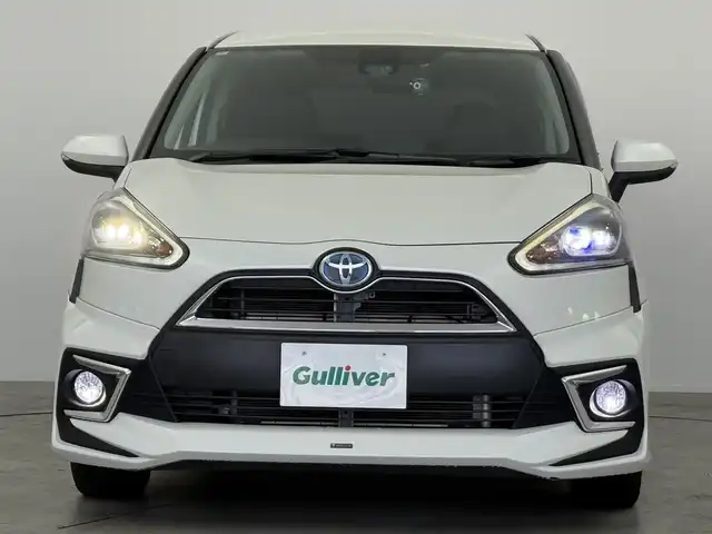 トヨタ シエンタ ハイブリッド G クエロ 愛知県 2017(平29)年 8.1万km ホワイトパールクリスタルシャイン トヨタセーフティーセンス　/・レーンディパラーチャー　/・衝突軽減ブレーキ　/・AUTOハイビーム　/・先行車発進告知機能/両側パワースライドドア/モデリスタエアロ　/純正SDナビ　/フルセグTV/Bluetooth　/ステアリングリモコン　/バックモニター　/純正AW/スマートキー　/LEDヘッドライト　/ビルトインETC　/革巻きステアリング　/ハーフレザーシート　/7人乗り/フォグランプ　