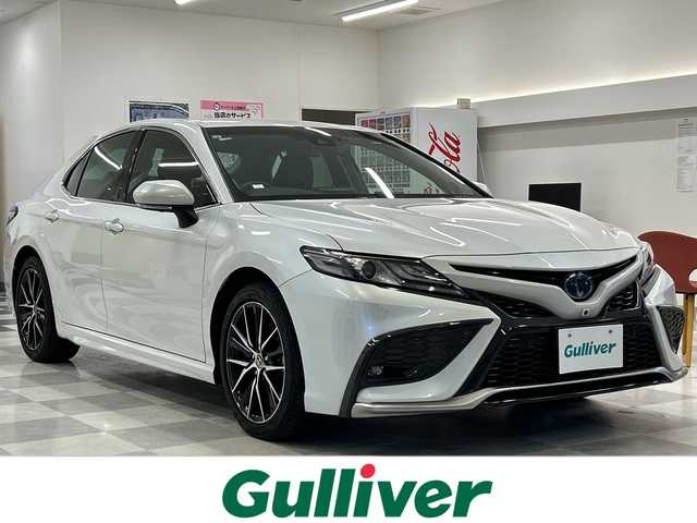 トヨタ カムリ 岐阜県 2021(令3)年 3.3万km プラチナホワイトパールマイカ 純正ナビ/トヨタセーフティーセンス/JBLプレミアムサウンドシステム/本革シート/バックカメラ/全方位カメラ/フルセグ/社外前方ドラレコ/BIuetooth/ETC2.0/USB入力端子/プッシュスタート/コーナーセンサー前後/パワーシート/シートヒーター運転席助手席/オートライト/オートマチックハイビーム/純正アルミホイール/LEDヘッドライト/レーンキープアシスト/MTモード付きAT/BSM/HUD/保証書/取扱説明書