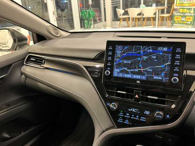 トヨタ カムリ 岐阜県 2021(令3)年 3.3万km プラチナホワイトパールマイカ 純正ナビ/トヨタセーフティーセンス/JBLプレミアムサウンドシステム/本革シート/バックカメラ/全方位カメラ/フルセグ/社外前方ドラレコ/BIuetooth/ETC2.0/USB入力端子/プッシュスタート/コーナーセンサー前後/パワーシート/シートヒーター運転席助手席/オートライト/オートマチックハイビーム/純正アルミホイール/LEDヘッドライト/レーンキープアシスト/MTモード付きAT/BSM/HUD/保証書/取扱説明書