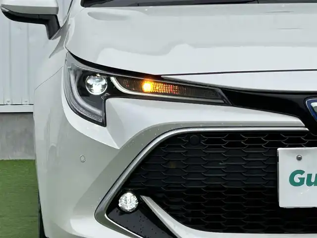 トヨタ カローラ スポーツ ハイブリッドG Z 香川県 2019(令1)年 4.1万km ホワイトパールクリスタルシャイン 純正９型ナビ/バックカメラ/レーダークルコン/前後コーナーセンサー/ヘッドアップディスプレイ/ドラレコ/ＢＳＭ/ＥＴＣ２．０/革巻きステアリング/ステアリングリモコン/ＬＥＤヘッドライト/フォグライト/純正ＡＷ/純正フロアマット
