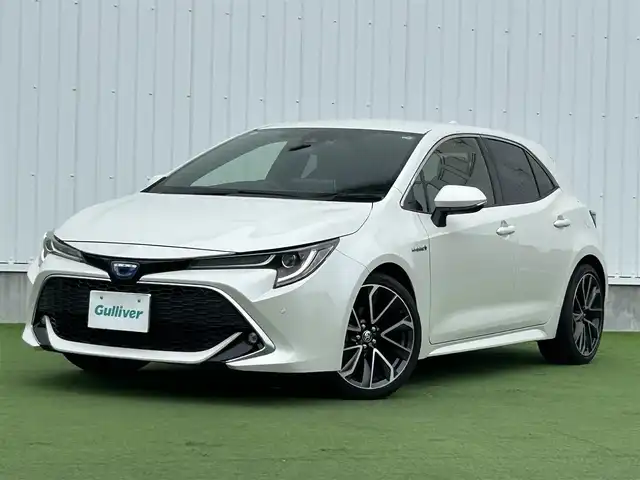 トヨタ カローラ スポーツ ハイブリッドG Z 香川県 2019(令1)年 4.1万km ホワイトパールクリスタルシャイン 純正９型ナビ/バックカメラ/レーダークルコン/前後コーナーセンサー/ヘッドアップディスプレイ/ドラレコ/ＢＳＭ/ＥＴＣ２．０/革巻きステアリング/ステアリングリモコン/ＬＥＤヘッドライト/フォグライト/純正ＡＷ/純正フロアマット